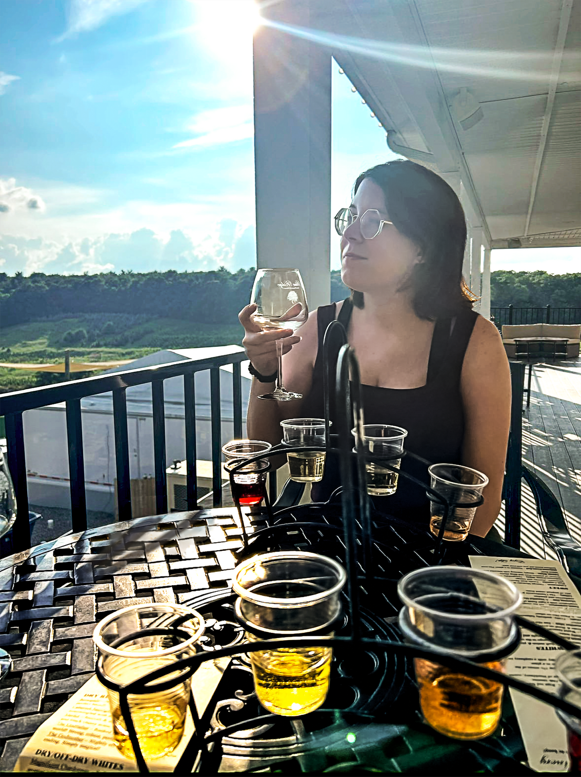 Tiffany After; I increased the vibrancy and overall quality of the photo, lessened the sun glare in her face, removed the person from the background, smoothed flyaway hairs, removed the phone on the table